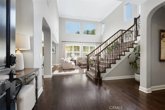 a view of entryway with wooden floor and windows