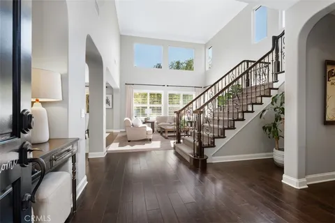 a view of entryway with wooden floor and windows