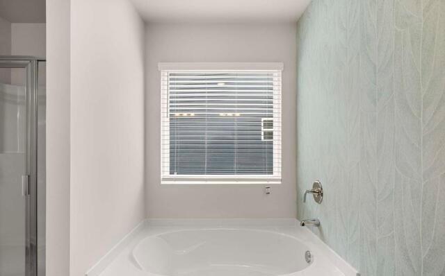 1260 Riverstone Road Jonesboro, GA 30236 - Photo 21 of 45 a bathroom with a bathtub