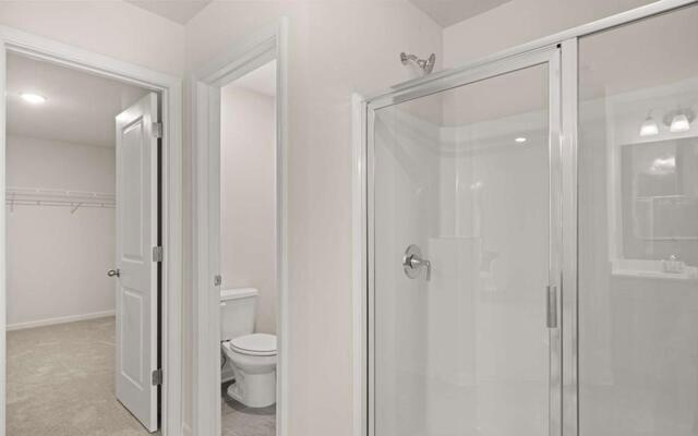 1260 Riverstone Road Jonesboro, GA 30236 - Photo 31 of 45 a bathroom with a granite countertop sink a toilet and shower