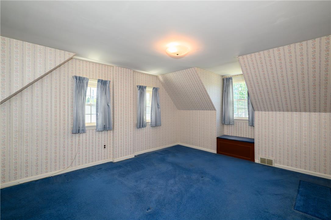 2270 Rodgers Street Bethlehem, PA 18017 - Photo 10 of 24 This cozy bedroom features sloped ceilings and ample natural light, creating a unique and inviting atmosphere.