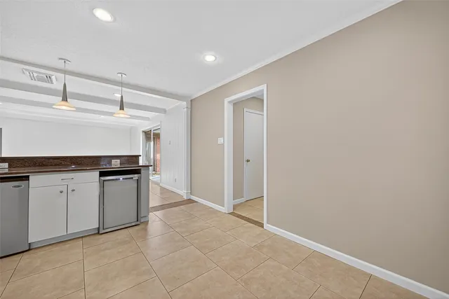 a kitchen with granite countertop a sink and cabinets