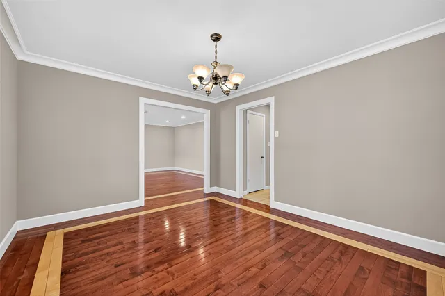 a view of room with wooden floor