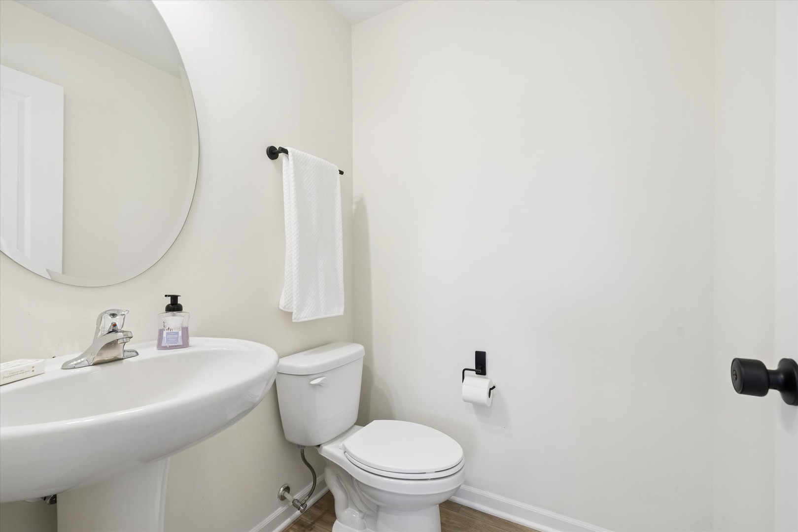 602 Apple Valley Road Harvard, IL 60033 - Photo 12 of 24 a bathroom with a sink a toilet and a mirror