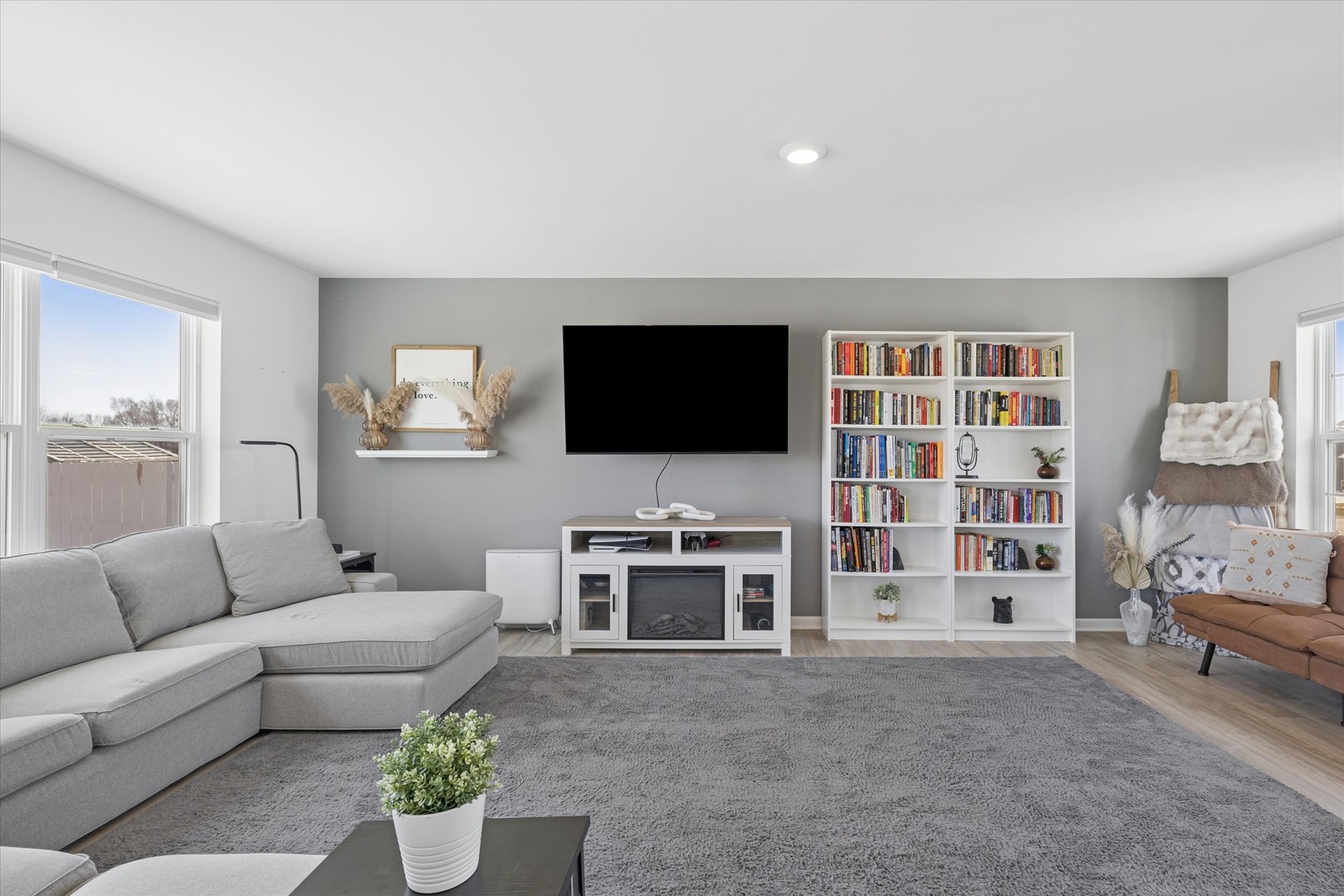 602 Apple Valley Road Harvard, IL 60033 - Photo 2 of 24 a living room with furniture and a flat screen tv