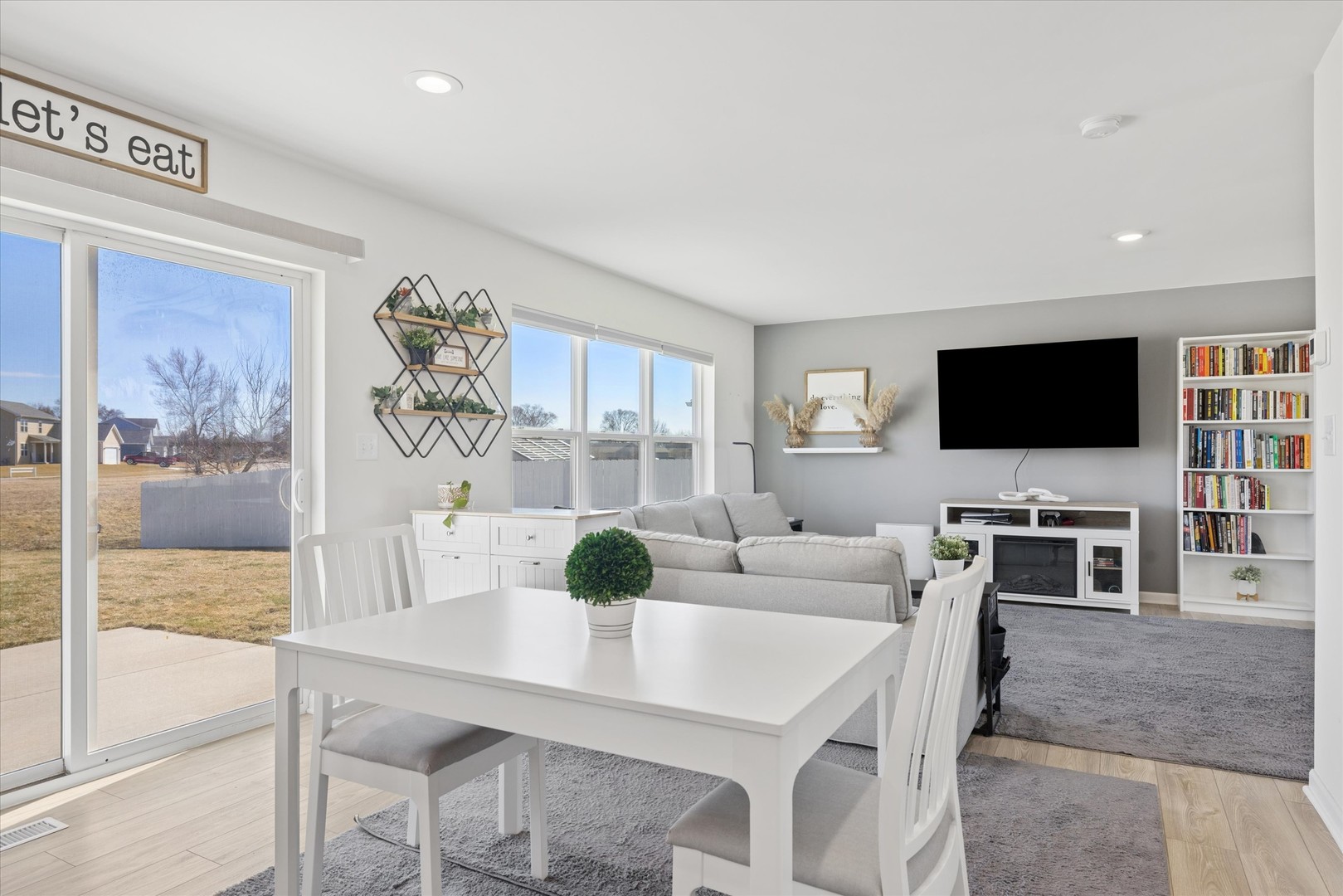602 Apple Valley Road Harvard, IL 60033 - Photo 3 of 24 a living room with furniture and a flat screen tv
