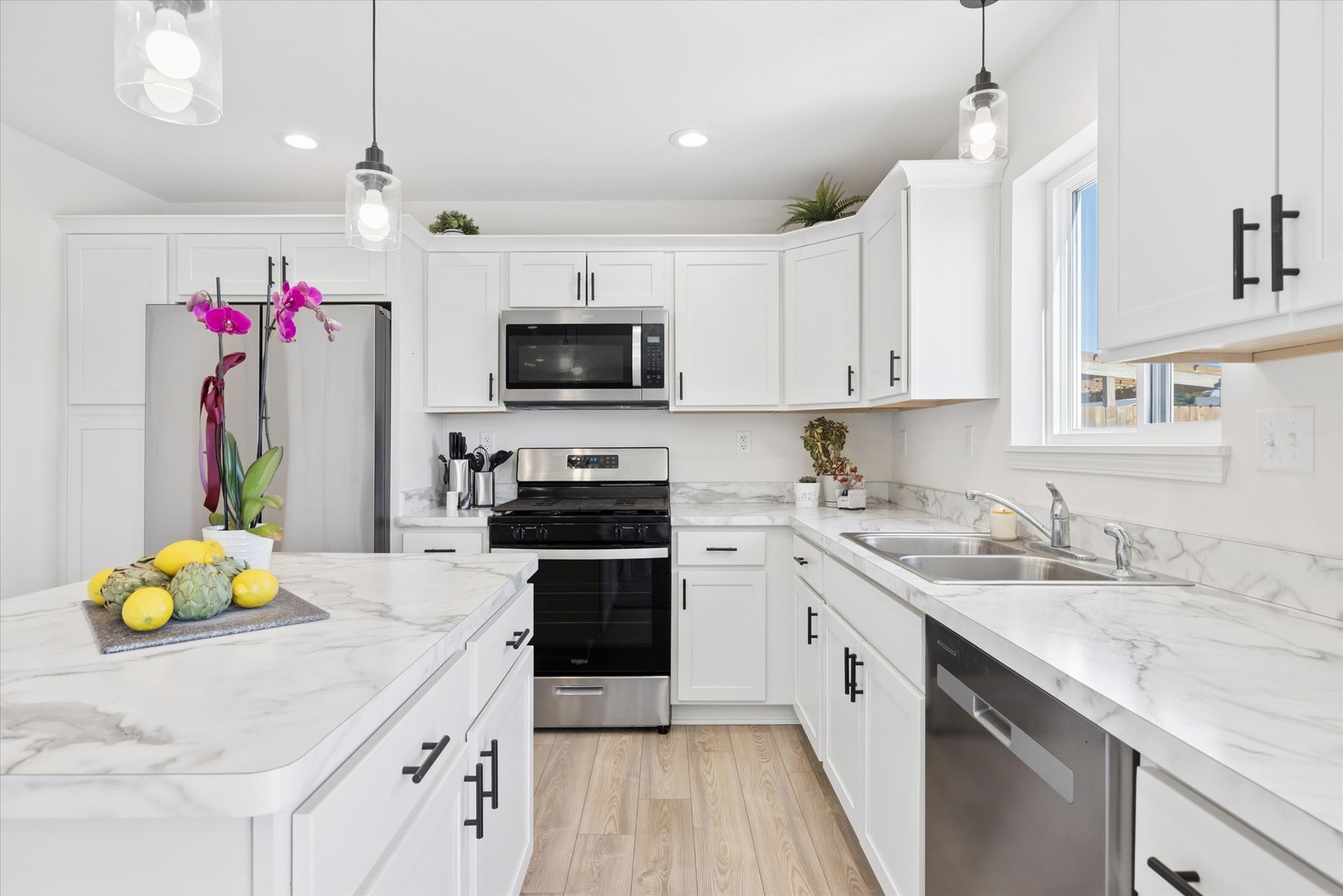 602 Apple Valley Road Harvard, IL 60033 - Photo 6 of 24 a kitchen with granite countertop a sink appliances and cabinets