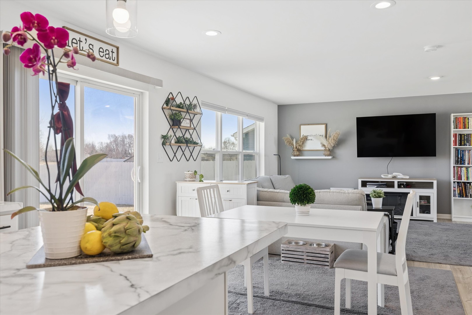 602 Apple Valley Road Harvard, IL 60033 - Photo 8 of 24 a view of a dining room with furniture and a potted plant