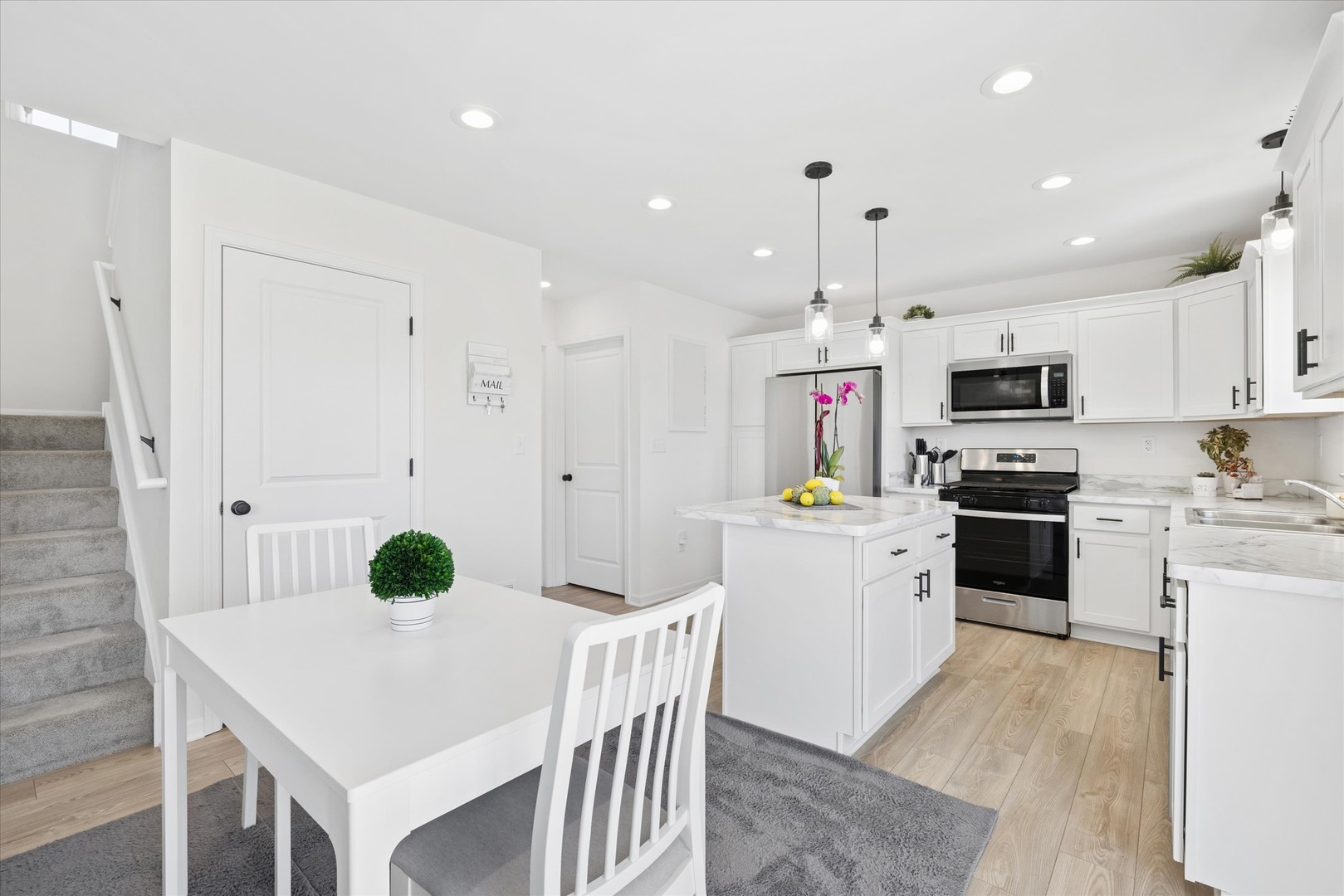 602 Apple Valley Road Harvard, IL 60033 - Photo 9 of 24 a kitchen that has a lot of cabinets a sink and appliances