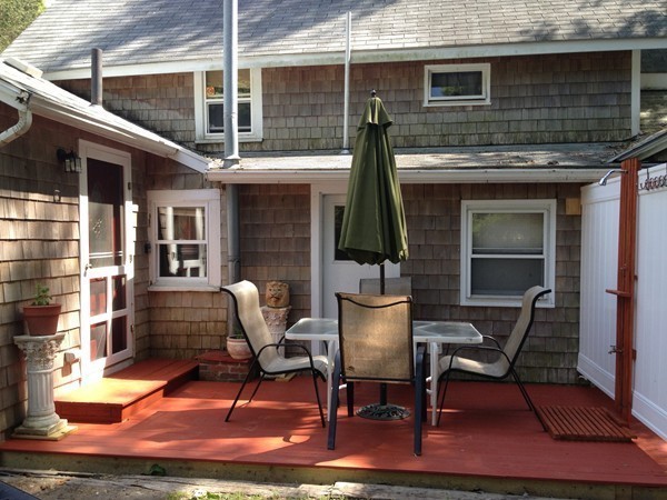 4 Bruce Street Wareham, MA 02532 - Photo 14 of 30 a front view of a house with outdoor seating