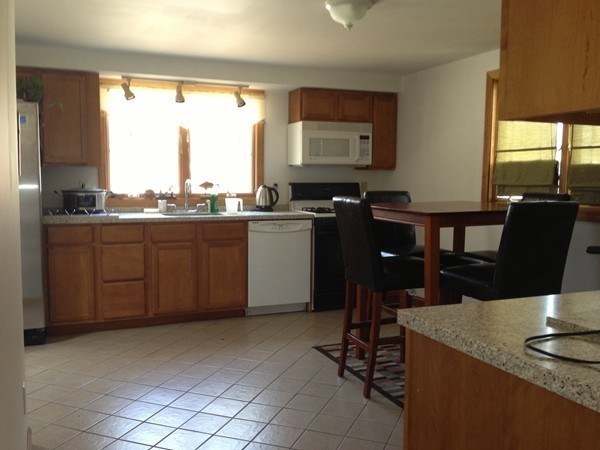 4 Bruce Street Wareham, MA 02532 - Photo 5 of 30 a kitchen with a counter top space appliances and a window