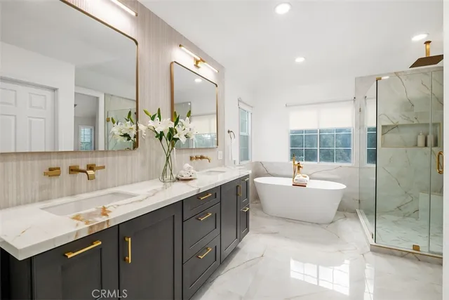 a spacious bathroom with a granite countertop sink mirror and double