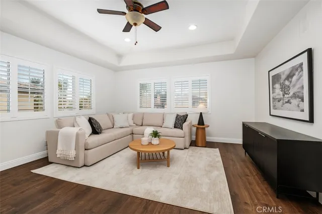a living room with furniture and windows