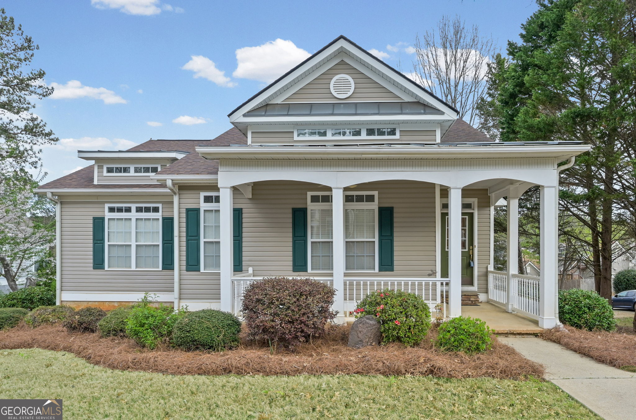 front view of a house with a yard