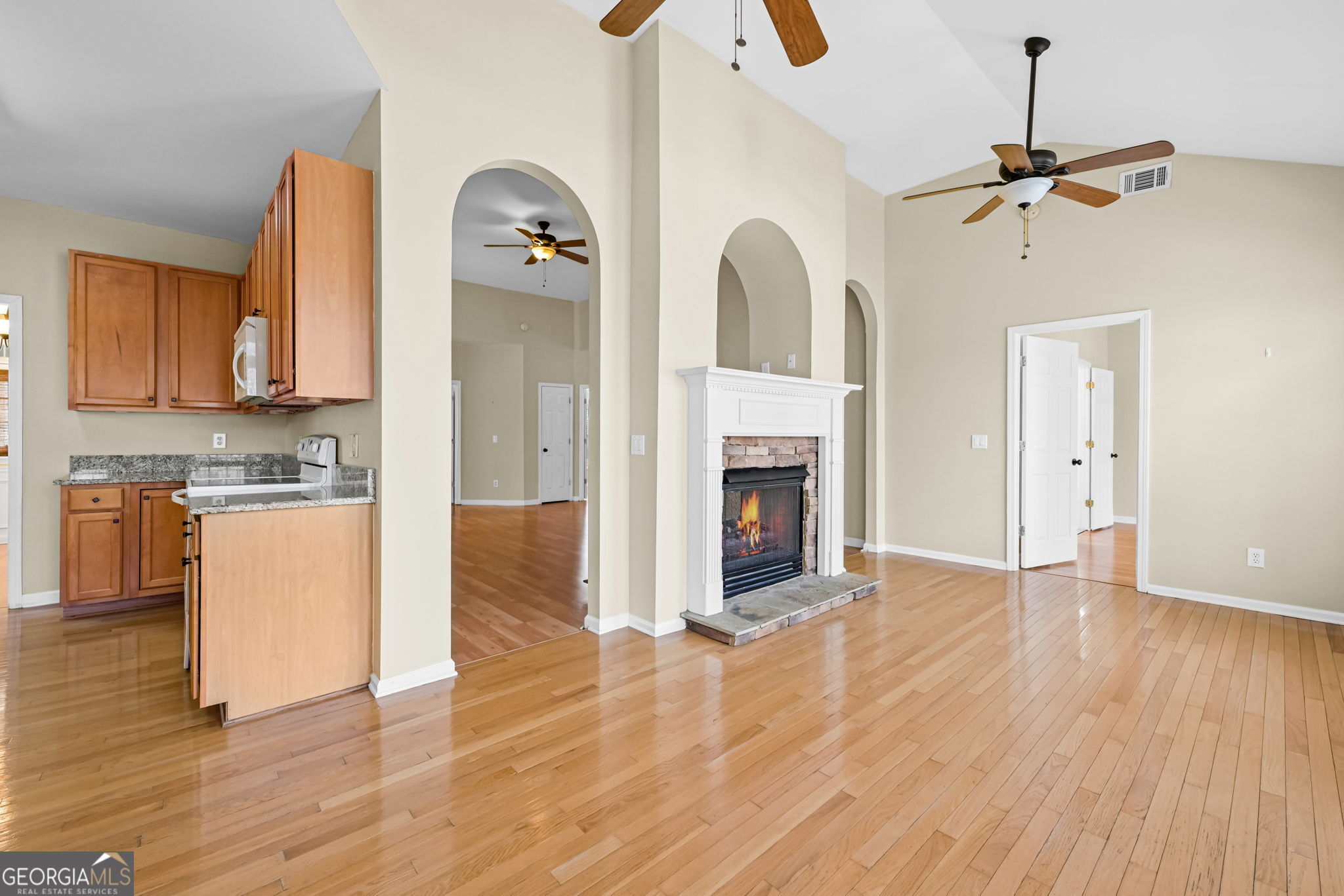 21 Verandah View Newnan, GA 30265 - Photo 12 of 39 a view of a kitchen with a sink a kitchen stove and wooden floor