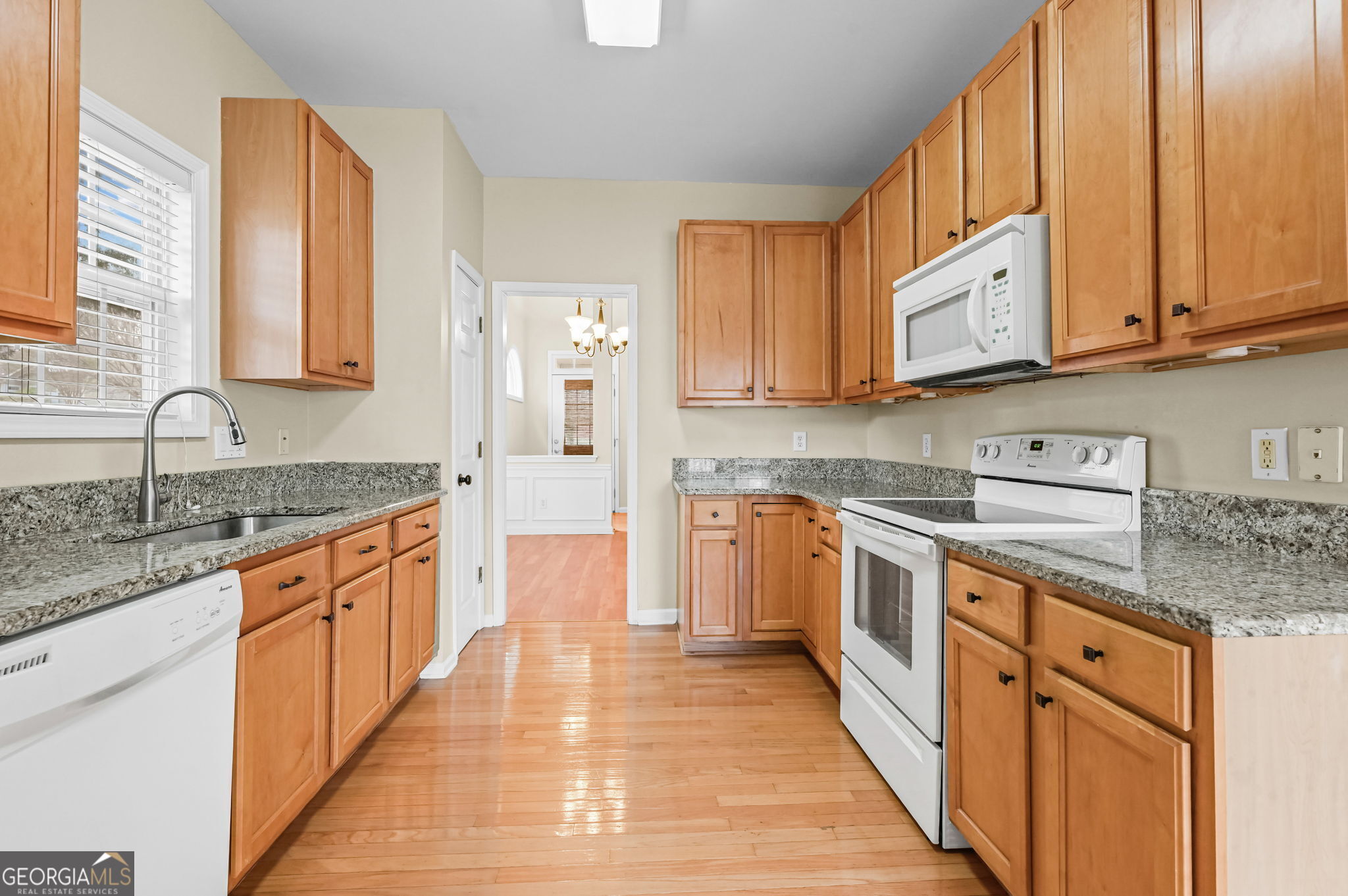 21 Verandah View Newnan, GA 30265 - Photo 13 of 39 a large kitchen with stainless steel appliances granite countertop a stove a sink dishwasher and a refrigerator
