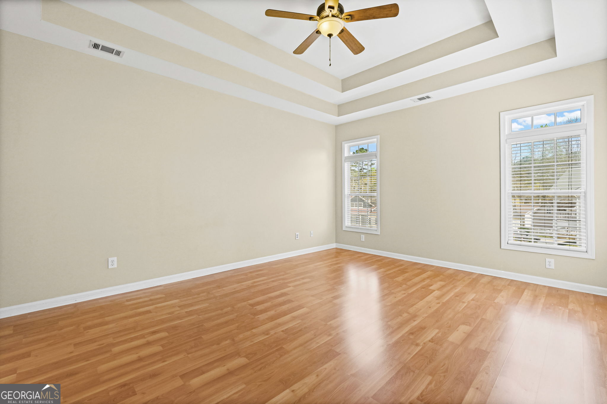 21 Verandah View Newnan, GA 30265 - Photo 16 of 39 a view of an empty room with wooden floor and a window