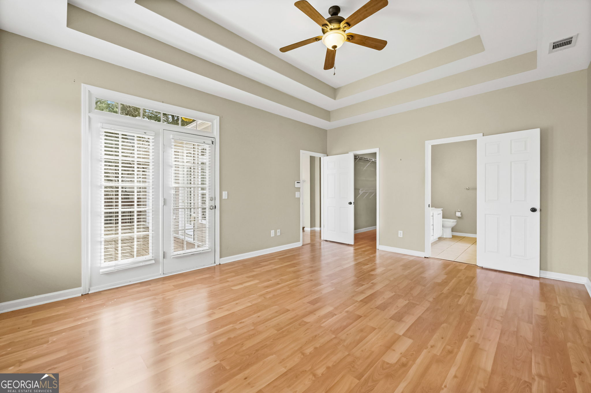 21 Verandah View Newnan, GA 30265 - Photo 17 of 39 a view of an empty room with wooden floor and a window
