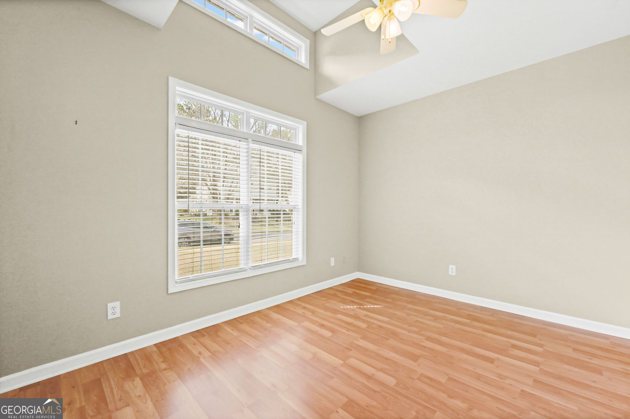21 Verandah View Newnan, GA 30265 - Photo 25 of 39 a view of an empty room with wooden floor and a window