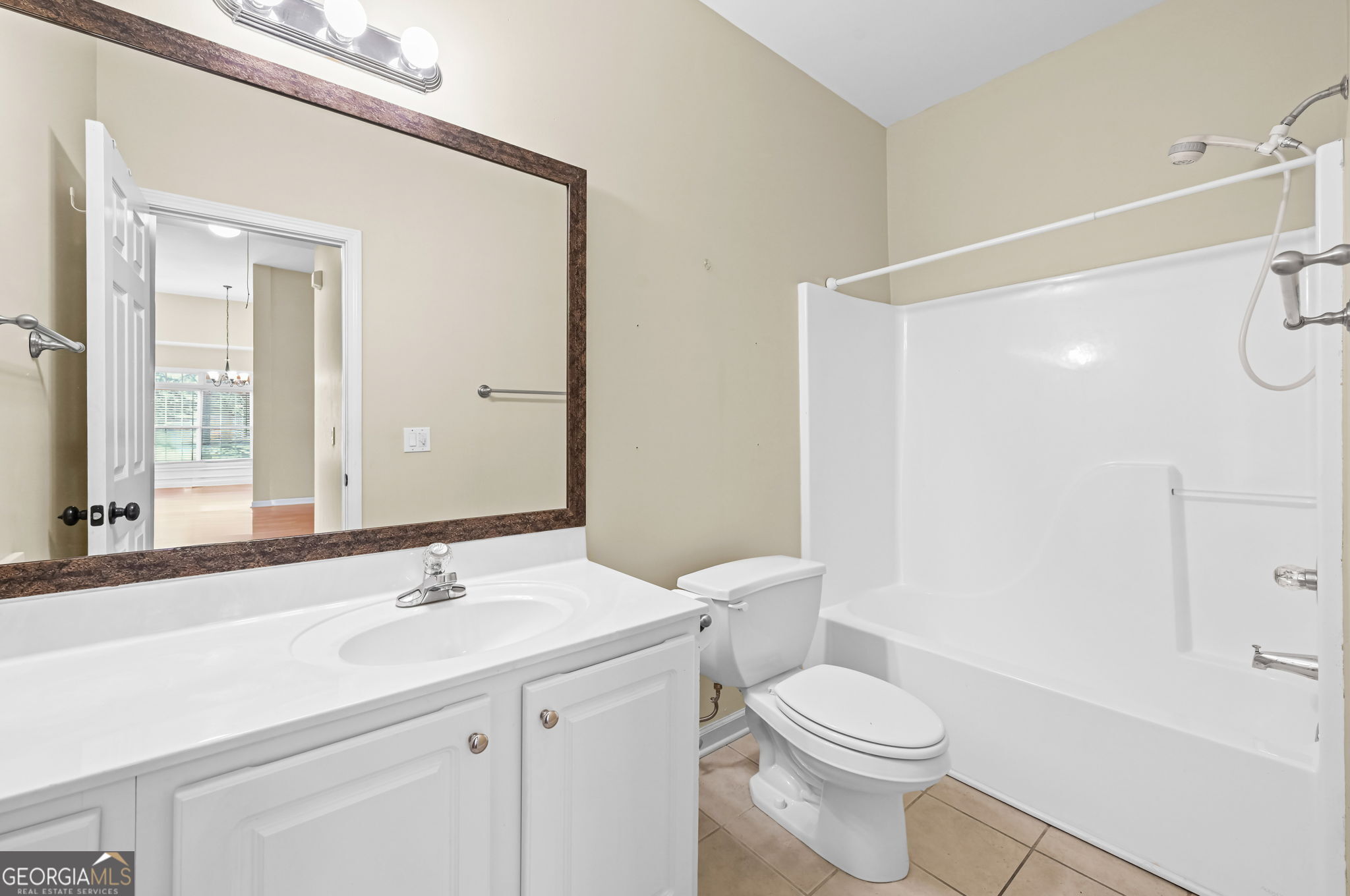 21 Verandah View Newnan, GA 30265 - Photo 27 of 39 a bathroom with a sink a toilet a mirror and shower