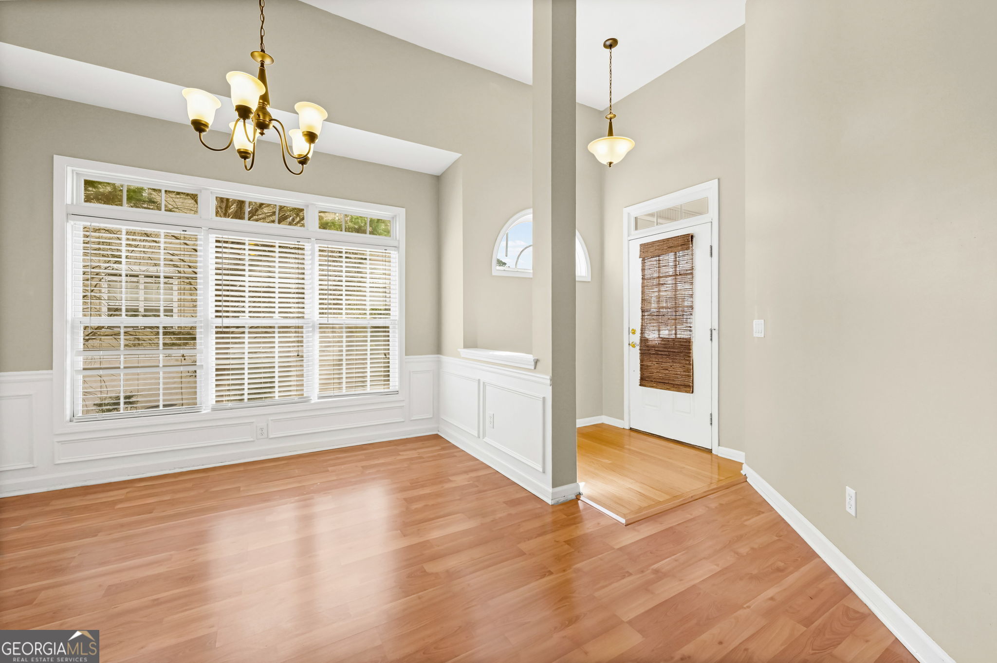 21 Verandah View Newnan, GA 30265 - Photo 4 of 39 a view of an empty room with a window and wooden floor