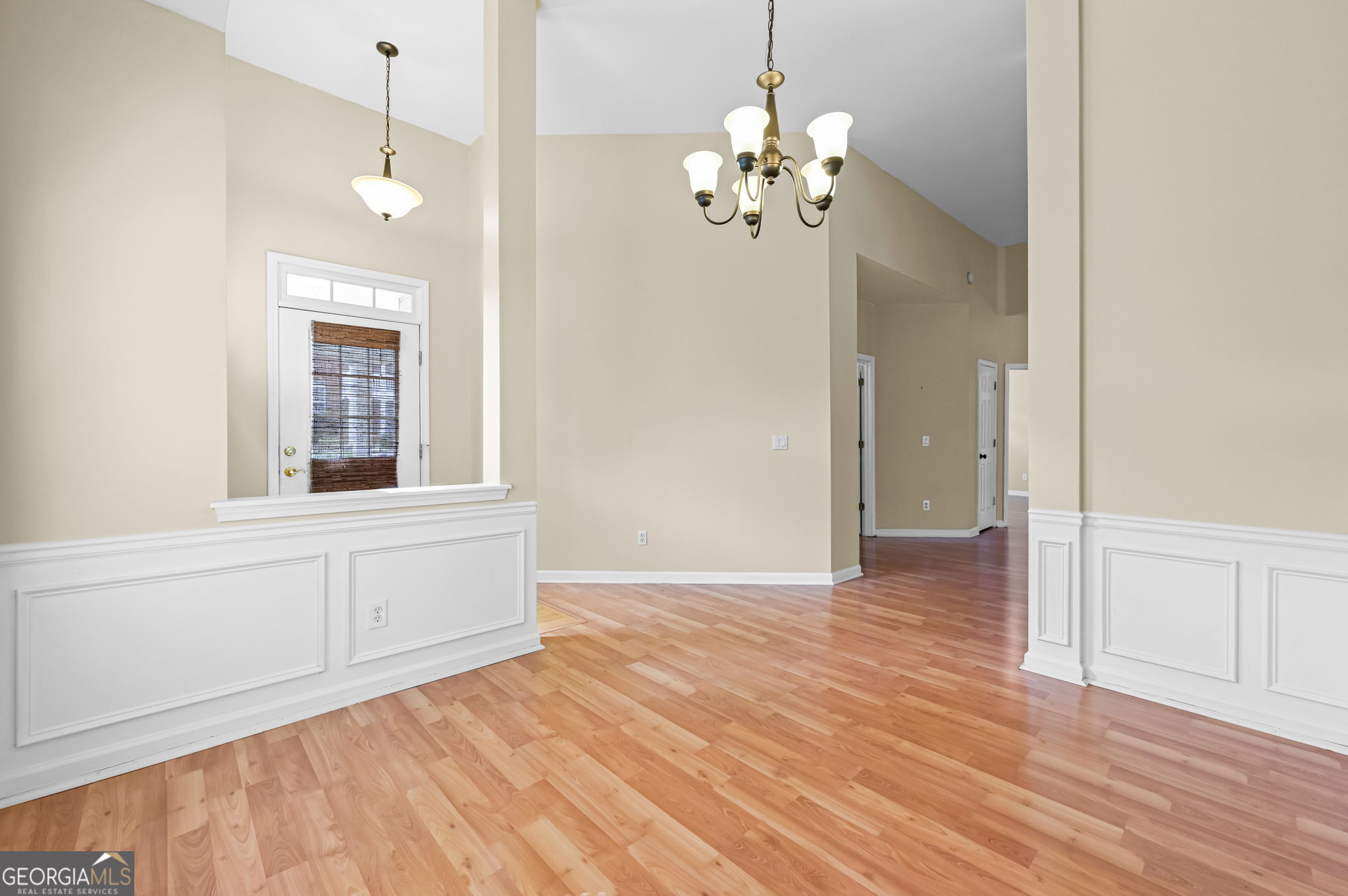21 Verandah View Newnan, GA 30265 - Photo 6 of 39 a view of an empty room with wooden floor and a window