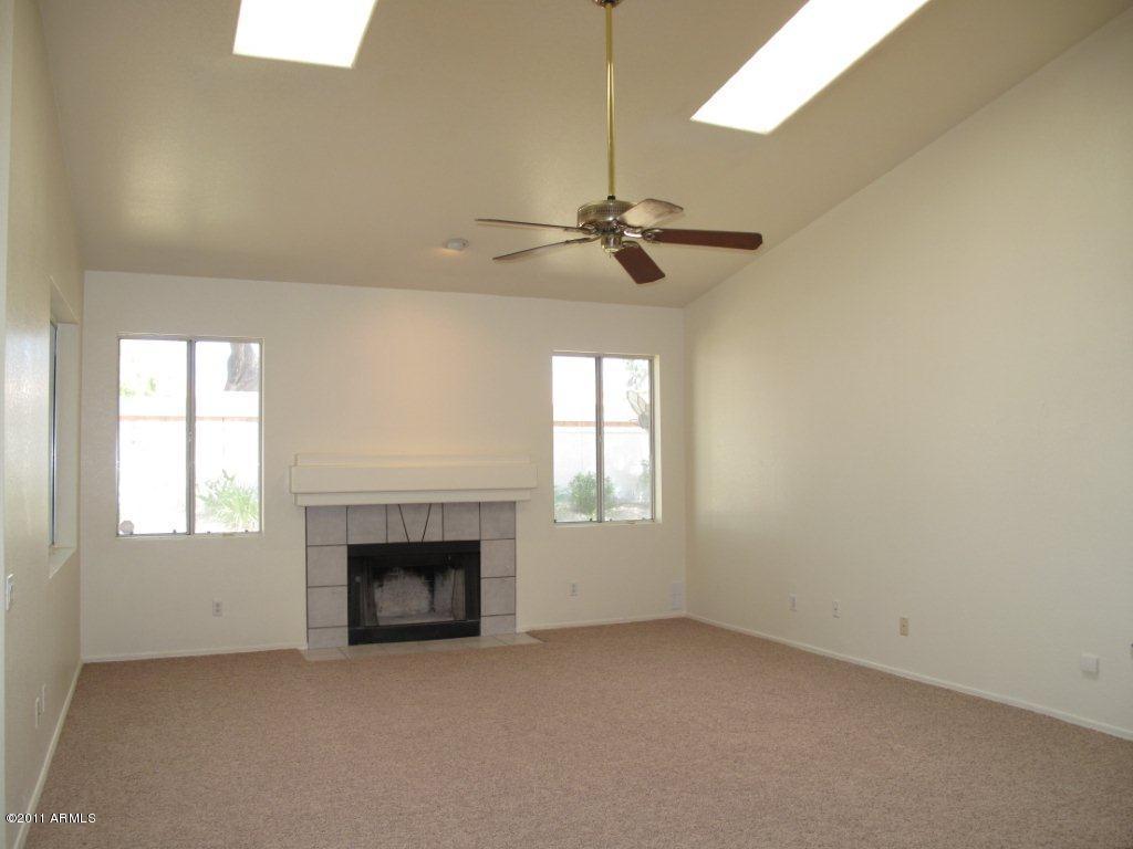 16037 South 38th Way Phoenix, AZ 85048 - Photo 7 of 17 FAMILY ROOM WITH FIREPLACE