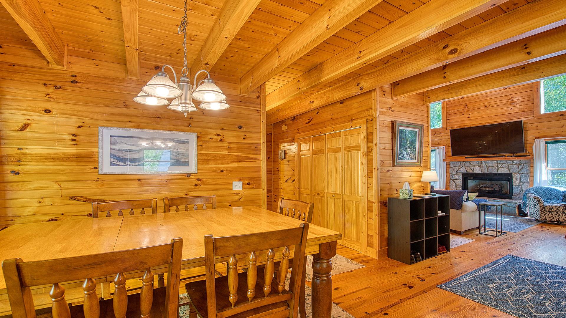 630 Nottingham Road Maggie Valley, NC 28751 - Photo 8 of 25 a view of a dining room with furniture and chandelier