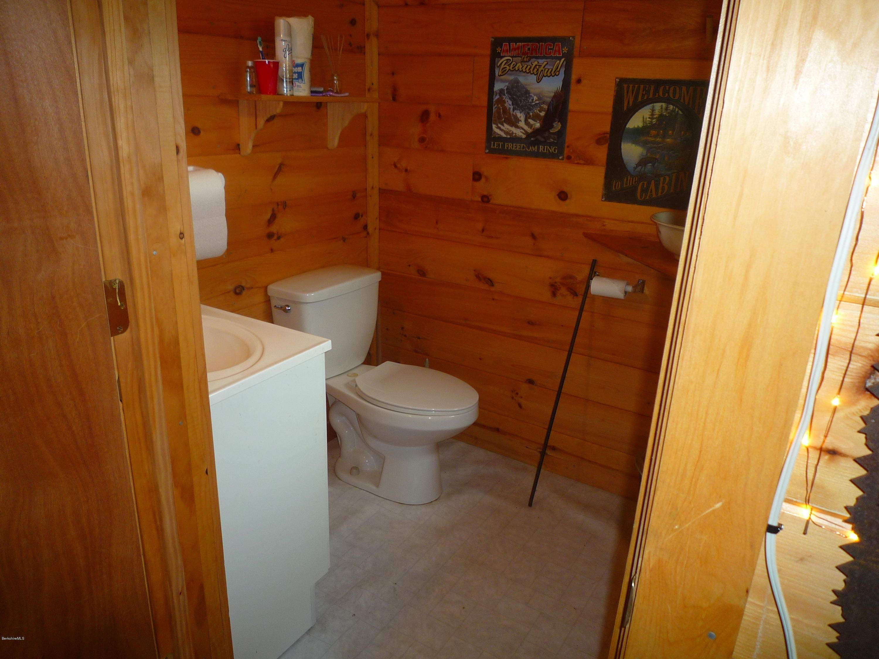 900 Risky Ranch Road Stamford, VT 05352 - Photo 15 of 15 a bathroom with a toilet and a shower