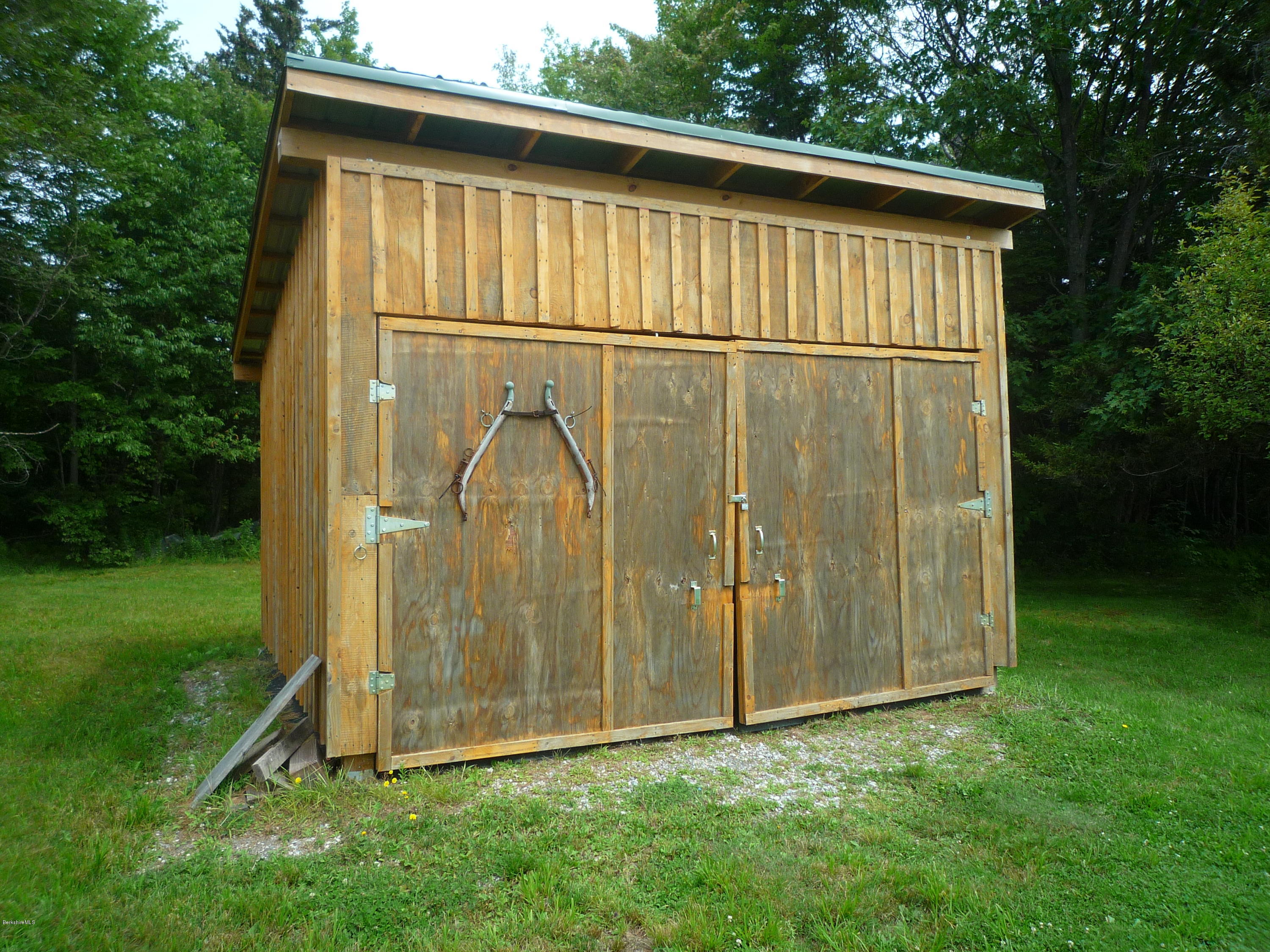 900 Risky Ranch Road Stamford, VT 05352 - Photo 6 of 15 a view of a small house with backyard
