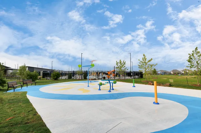 a view of a big yard with lots of green space