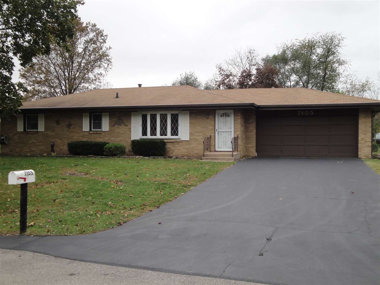 7155 Ralph Road Rockford, IL 61109 - Photo 1 of 18 a front view of a house with garden