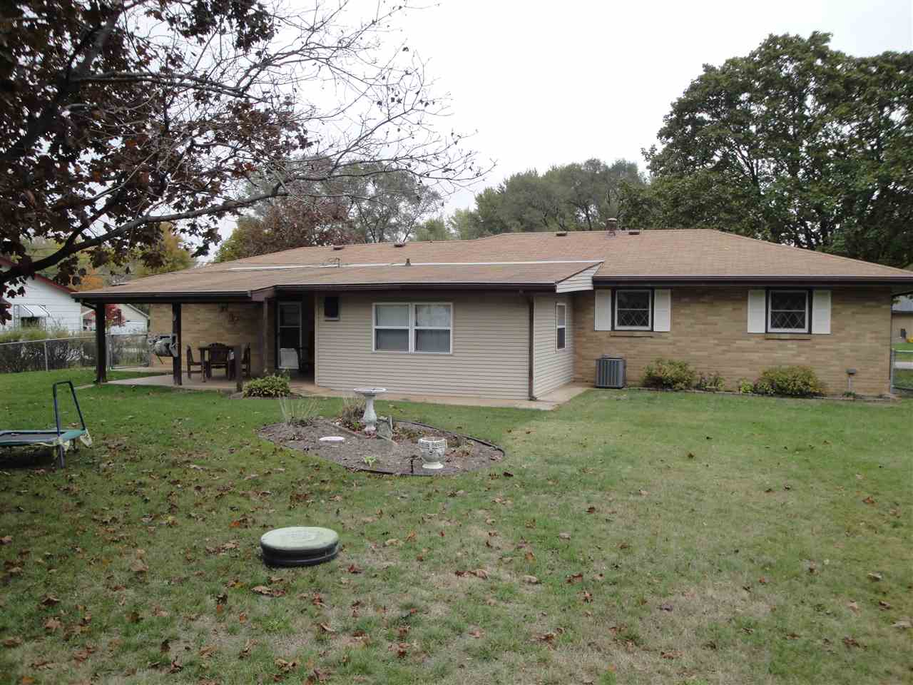 7155 Ralph Road Rockford, IL 61109 - Photo 15 of 18 a front view of a house with garden