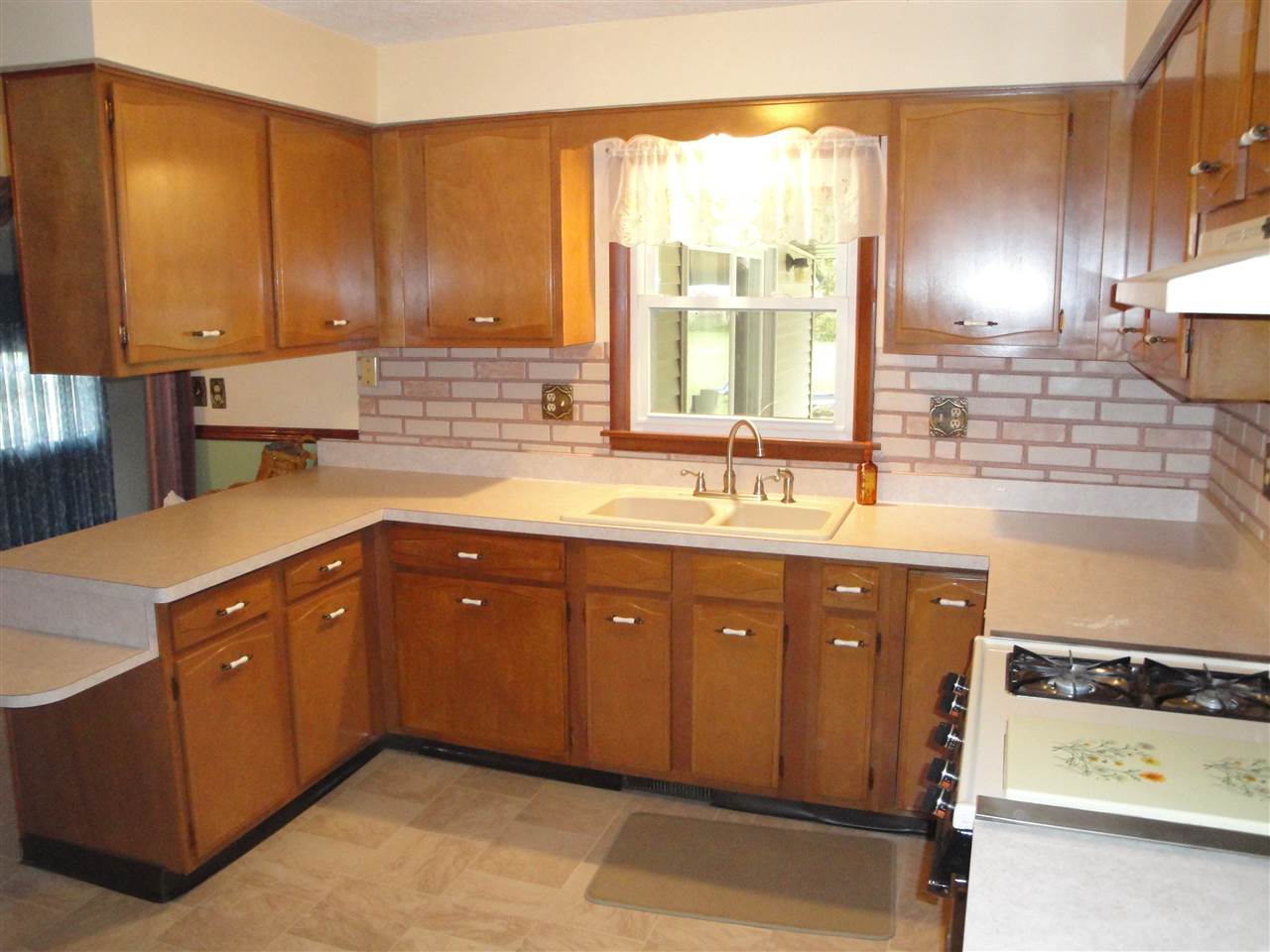 7155 Ralph Road Rockford, IL 61109 - Photo 2 of 18 a spacious bathroom with a granite countertop sink and a mirror
