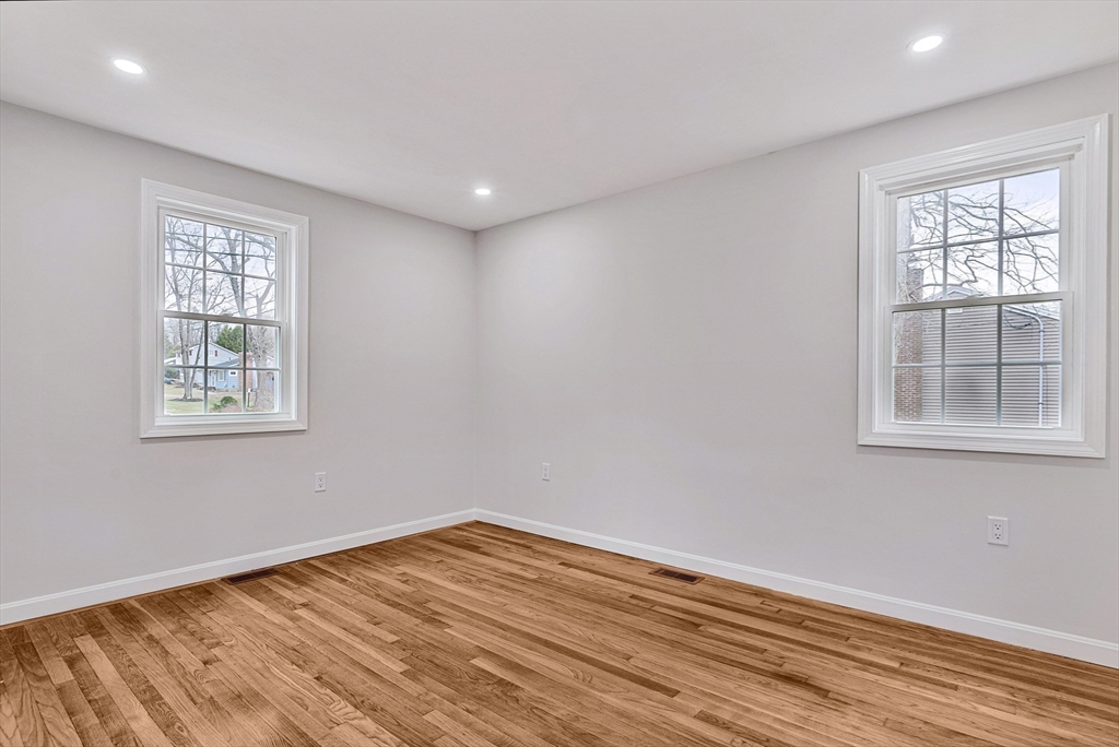 76 Sunset Drive Brockton, MA 02301 - Photo 11 of 32 a view of empty room with wooden floor and fan