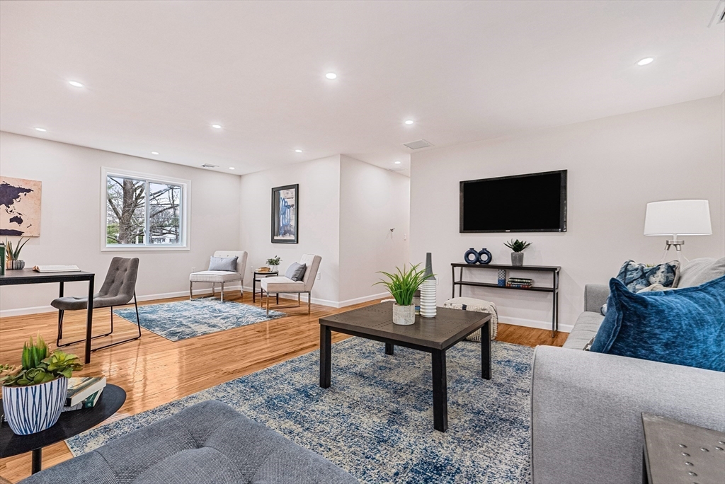 76 Sunset Drive Brockton, MA 02301 - Photo 17 of 32 a living room with furniture and a flat screen tv
