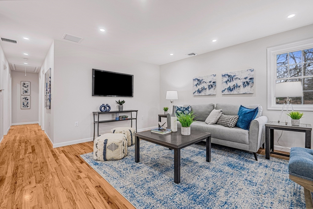 76 Sunset Drive Brockton, MA 02301 - Photo 21 of 32 a living room with furniture and a flat screen tv