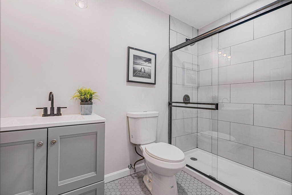 76 Sunset Drive Brockton, MA 02301 - Photo 23 of 32 a bathroom with a toilet sink and shower