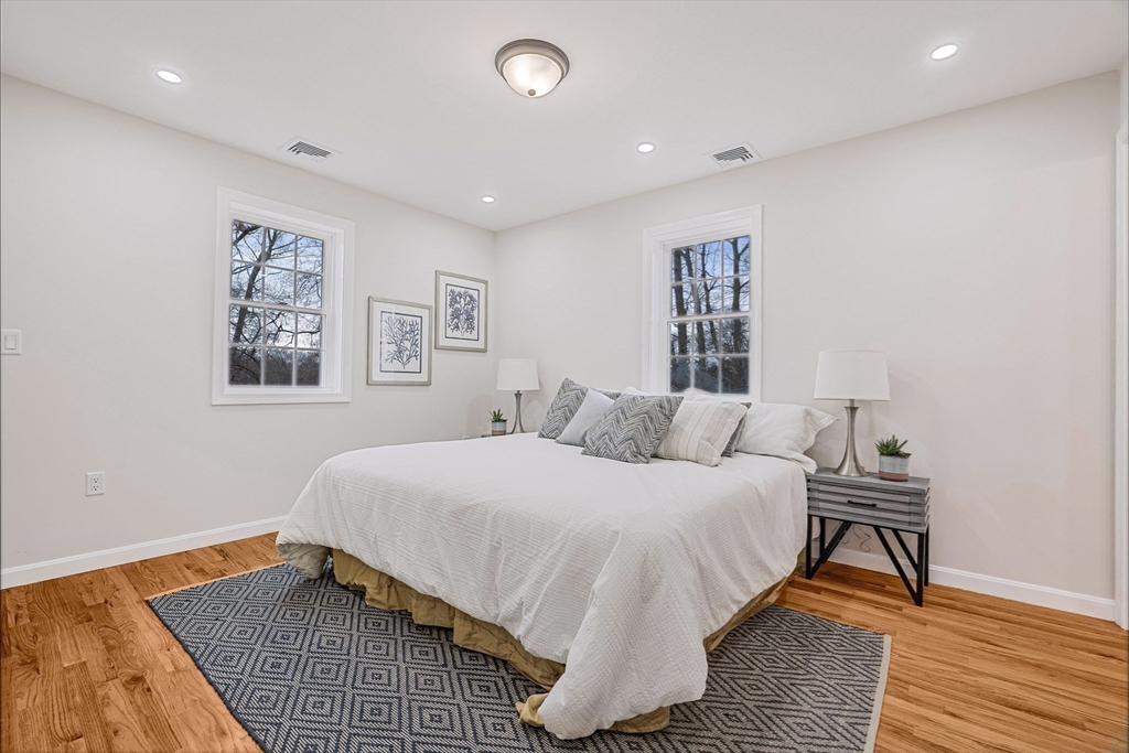 76 Sunset Drive Brockton, MA 02301 - Photo 24 of 32 a bedroom with a bed and a table