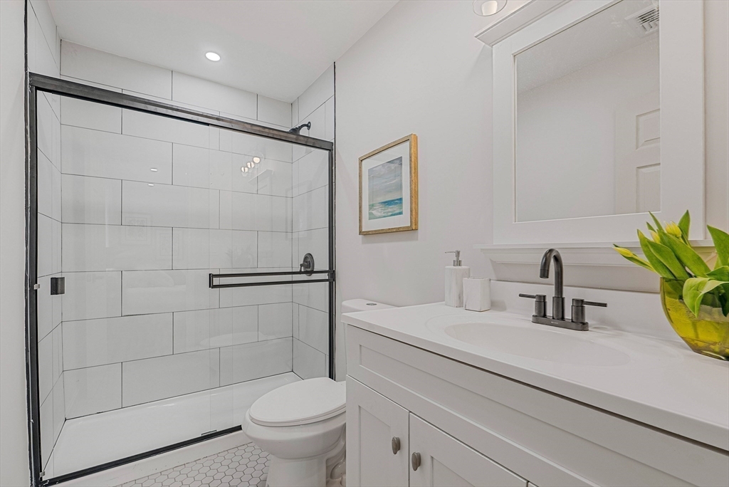 76 Sunset Drive Brockton, MA 02301 - Photo 27 of 32 a bathroom with a sink a toilet and shower