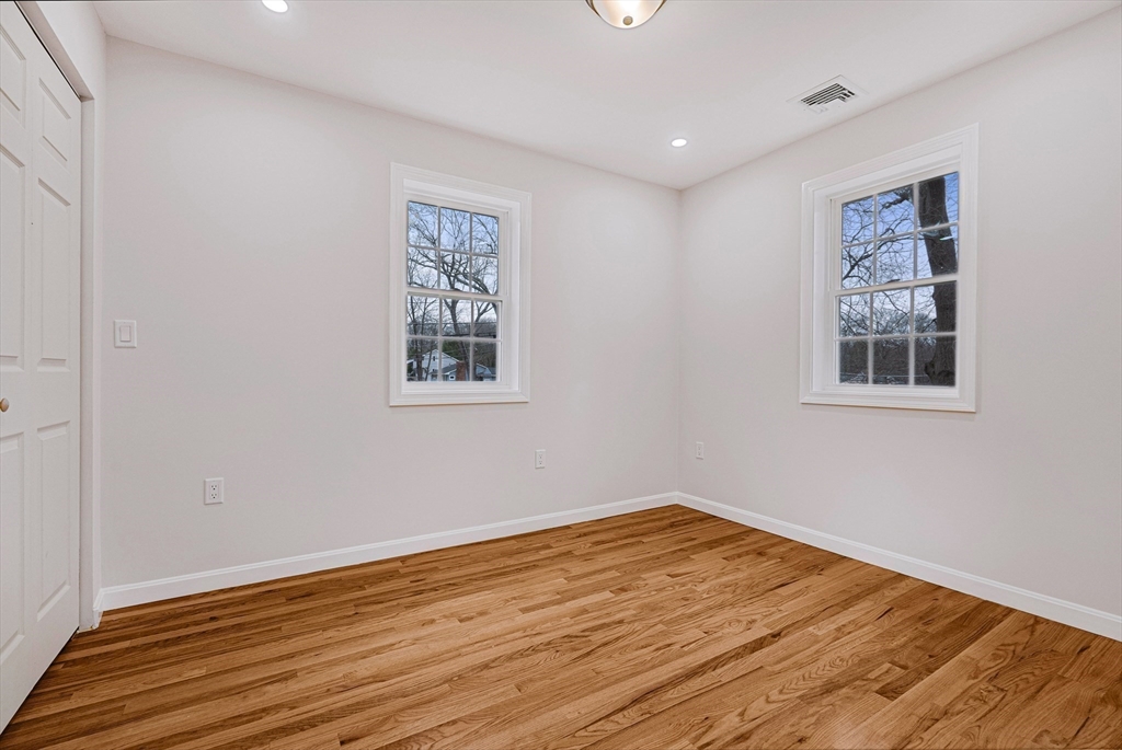 76 Sunset Drive Brockton, MA 02301 - Photo 28 of 32 a view of empty room with wooden floor and fan