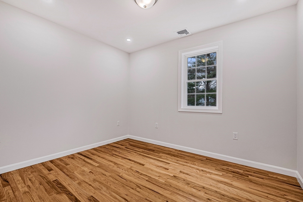 76 Sunset Drive Brockton, MA 02301 - Photo 29 of 32 a view of empty room with wooden floor
