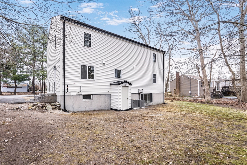 76 Sunset Drive Brockton, MA 02301 - Photo 32 of 32 a view of a house with a yard