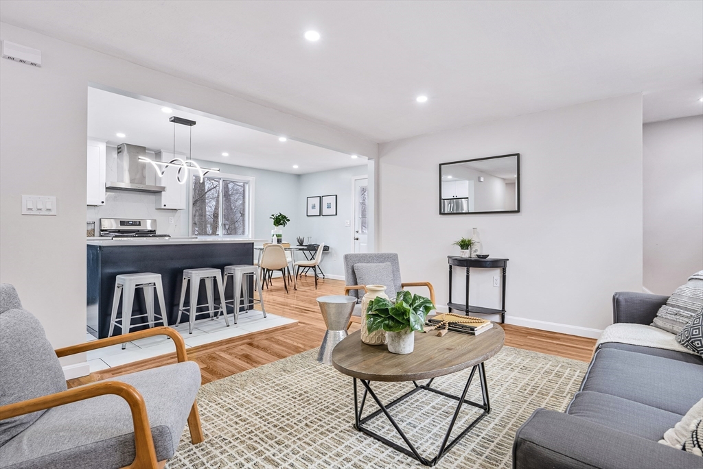 76 Sunset Drive Brockton, MA 02301 - Photo 4 of 32 a living room with furniture and a kitchen view