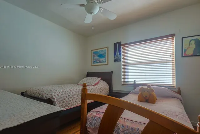 a bedroom with a bed and cabinet