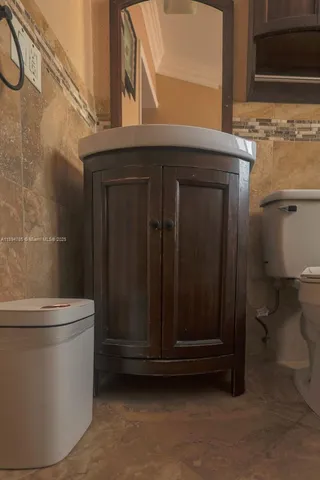 a bathroom with a sink and mirror