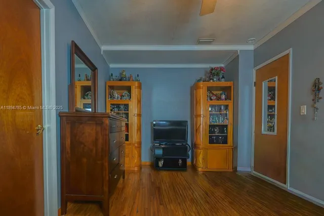 a backyard of a house with barbeque oven table and chairs