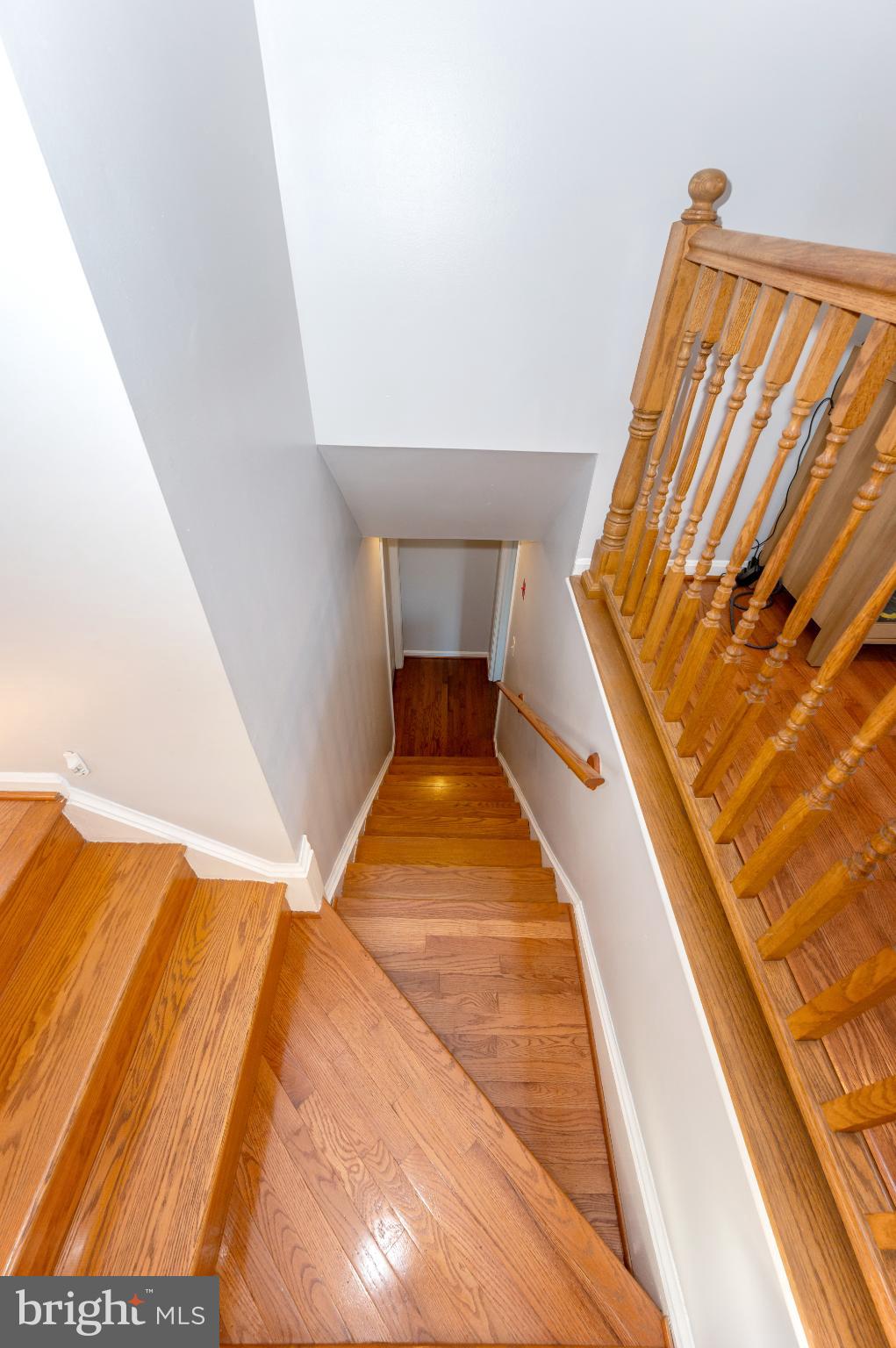 10453 Sweepstakes Road Damascus, MD 20872 - Photo 30 of 56 Inviting staircase with warm wooden tones.