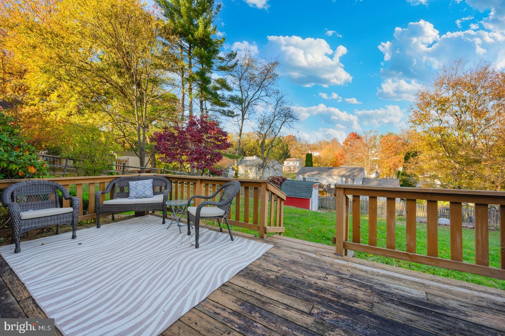 10453 Sweepstakes Road Damascus, MD 20872 - Photo 50 of 56 Serene deck with autumn foliage backdrop.
