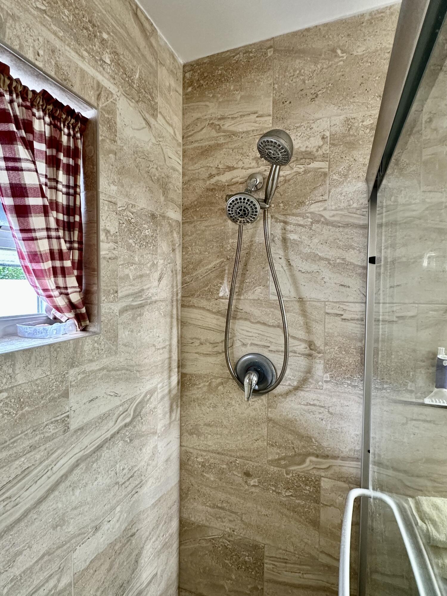 728 Ridge Road, Unit 35 Lantana, FL 33462 - Photo 11 of 35 a bathroom with a shower